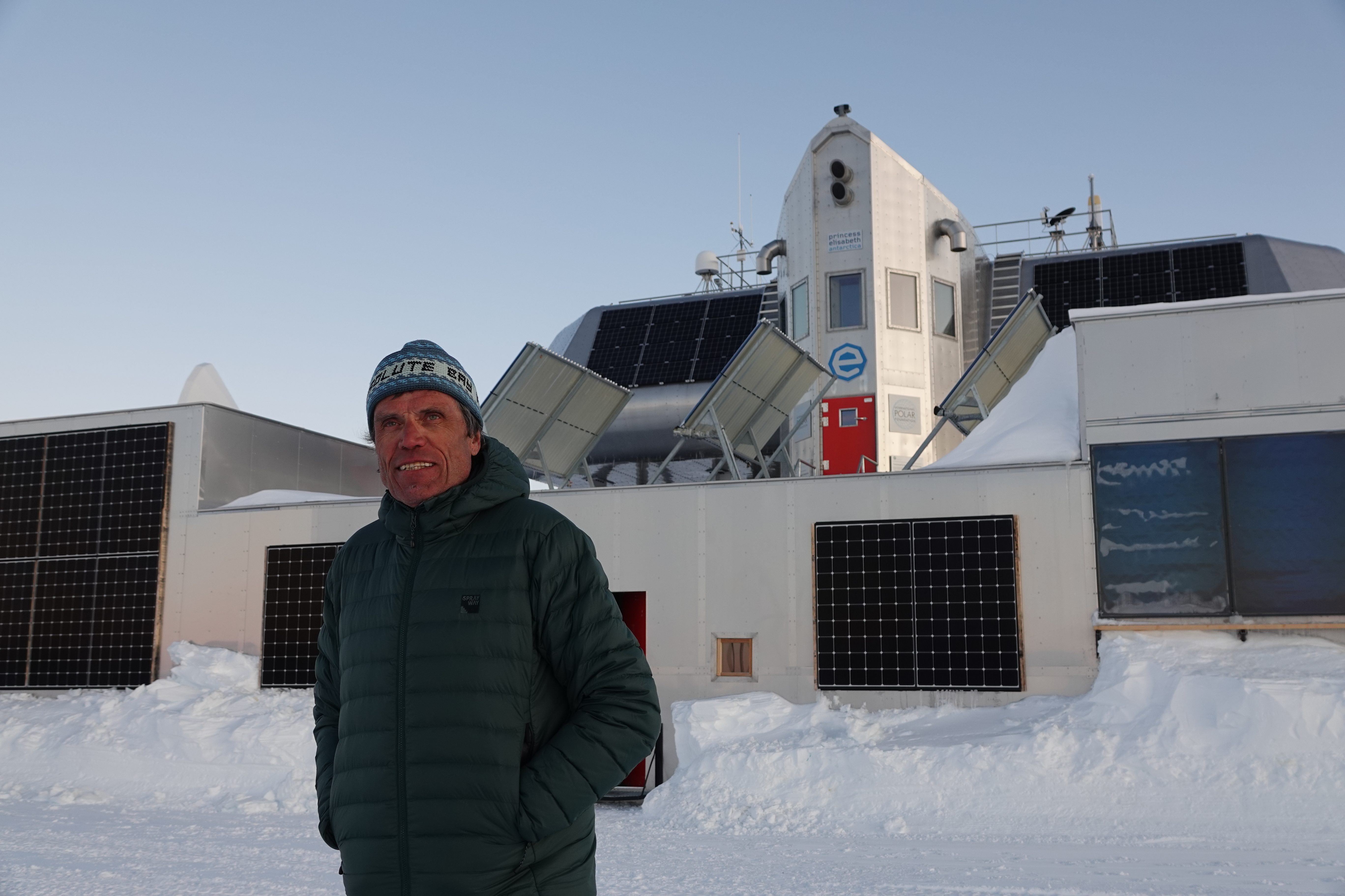 Alain Hubert poses in front of the Princess Elisabeth Antarctica, November 2023